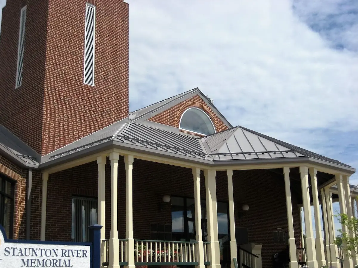 Skilled roofing craftsmen working on a residential roof in Bellefontaine